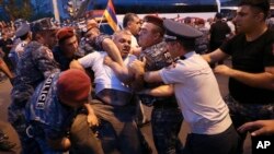 Armenia - Police detain demonstrators during an opposition rally in Yerevan, June 3, 2022. 