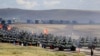 China și Rusia își etalează bunele relații prin exerciții militare comune. Efectul Afganistan