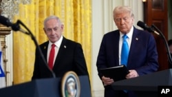 US President Donald Trump (right) and Israeli Prime Minister Benjamin Netanyahu at a February 4 news conference
