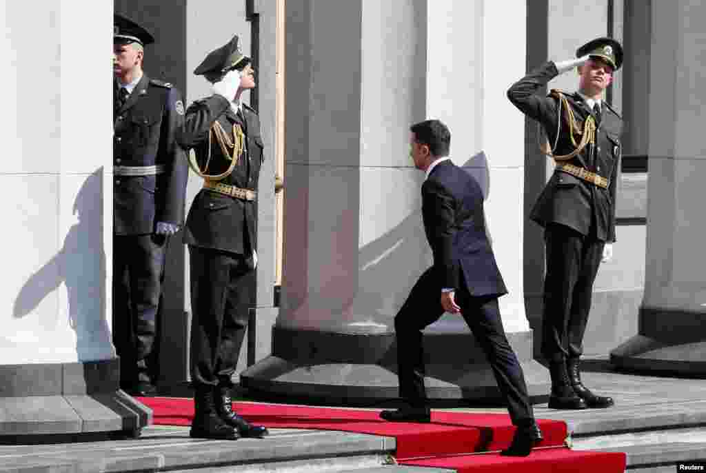 Zelenskiy heads into the building of Ukraine&#39;s parliament, the Verkhovna Rada.