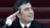 A young Saakashvili salutes during his inauguration ceremony in 2004. Many held high hopes for his leadership. 