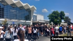 Protesters in Novi Sad pay tribute on May 1 to victims of the railway station canopy collapse that sparked nationwide demonstrations