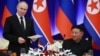 Ruski predsjednik Vladimir Putin (lijevo) i sjevernokorejski vođa Kim Jong Un na državnom prijemu u Pjongjangu u junu gdje je dogovoren sporazum