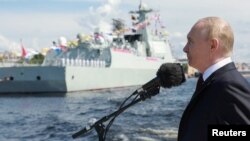 Russia's President Vladimir Putin speaks at a Navy Day parade in St Petersburg on July 28.