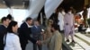 Afghan refugees and Ukrainian citizens evacuated from Kabul arrive in Kyiv in August 2021. 
