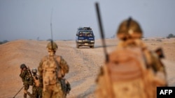 British soldiers search for explosives in Helmand Province in southern Afghanistan.