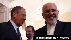 Russian Foreign Minister Sergei Lavrov (left) welcomes his Iranian counterpart, Mohammad Javad Zarif, during their meeting in Moscow on May 14.
