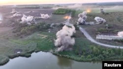 Drone footage from a Ukrainian drone shows what Kyiv's military says are artillery strikes on Russian troops east of Pokrovsk on August 21.