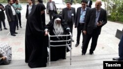 Azam Taleghani (center) arrives at the Iranian Interior Ministry on April 14 to register as a candidate in the country's presidential election.