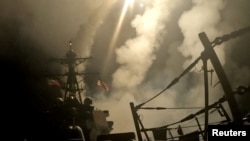A ship fires missiles at an undisclosed location after U.S. President Donald Trump launched military strikes against Yemen's Iran-aligned Houthis on March 15, 2025.