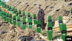 The burial on July 11 of 308 newly identified victims killed by Bosnian Serb forces in Srebrenica