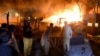 Police and firefighters arrive at the scene of an explosion at a five-star hotel in Quetta, the capital of southwestern Balochistan Province, on April 21.