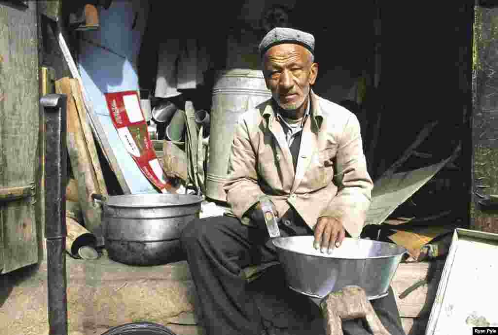 Artisans hammer metal bowls, pans, and pots, carve wood, and hone brightly decorated knives.