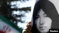 A demonstrator holds a picture of Sakineh Mohammadi Ashtiani at a protest in front of the Iranian Embassy in Rome earlier this month.