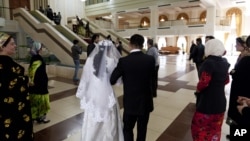 Newlyweds arrive at a civil marriage-registration office in Dushanbe.