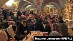 Attendees of the Peter and Fevronia Club mingle at Moscow's Dormition Church.