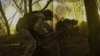 Ukrainian soldiers fire a field artillery gun toward Russian troops at a frontline position in the Zaporizhzhya region on March 31.