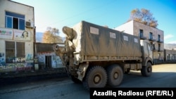 NAGORNO-KARABAKH -- An Azeri military truck drives along a street in the town of Hadrut, November 25, 2020