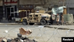 Sandals belonging to victims lie at the site of a bomb attack in Baghdad on August 17.