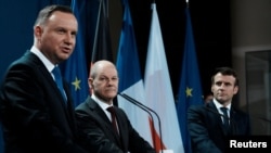 Andrzej Duda, președintele Poloniei, alături de Olaf Scholz, cancelarul Germaniei și președintele francez Emmanuel Macron. 