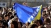 Croatia -- A girl waves a Bosnian flag in front of the prison uring the welcome ceremony for Bosnian Muslim Fikret Abdic in Pula, 09Mar2012