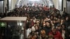 People take shelter in a metro station during an air raid alarm in Kyiv on December 20. 