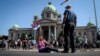 serbia -- Anti-government protestors stand in front of the parliament building ahead of the inaugural parliament session in Belgrade, on August 3, 2020.