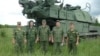 Российские солдаты на фоне установки "Бук" - иллюстрация из расследования международной группы журналистов Bellingcat.