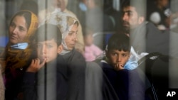 Evacuați din Afganistan, aceștia așteaptă să ajungă în Statele Unite sau într-o altă locație sigură.
