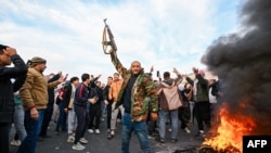 SYRIA - People celebrate at Umayyad Square in Damascus on December 8, 2024.