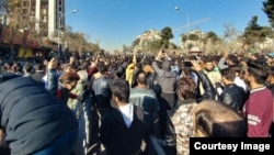 Iranians take to the streets of Mashhad in one of several demonstrations in the country against increasingly high prices and other economic ills.