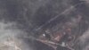 A satellite image shows a long traffic jam of vehicles along the Lachin corridor as ethnic Armenians flee from Nagorno-Karabakh, September 26, 2023. 