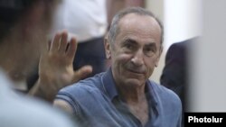 Former Armenian President Robert Kocharian waves to supporters during his trial, Yerevan, September 20, 2019.
