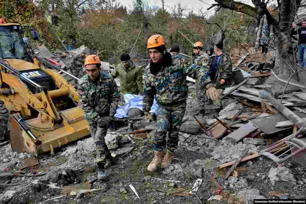 Rescuers carry the victim of a rocket attack on the city of Stepanakert on November 6. 