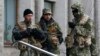 In Eastern Ukraine, The Hunt For A Smoking Gun -- And A Real Russian Holding It