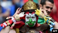 An Italian fan waits for the Euro 2012 semi-final against Germany.