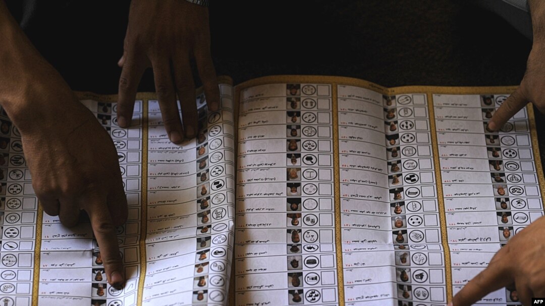Afghan election workers count votes at a polling station in Kabul. Official preliminary results are expected on September 3 and final results are expected to be released on September 17.