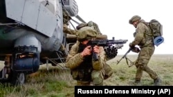 Russian troops take part in drills in Crimea, which Moscow forcibly seized from Ukraine in 2014.