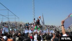 Nekpa (center, in white) is swallowed up by the crowd at Ghazi Stadium (click to enlarge)